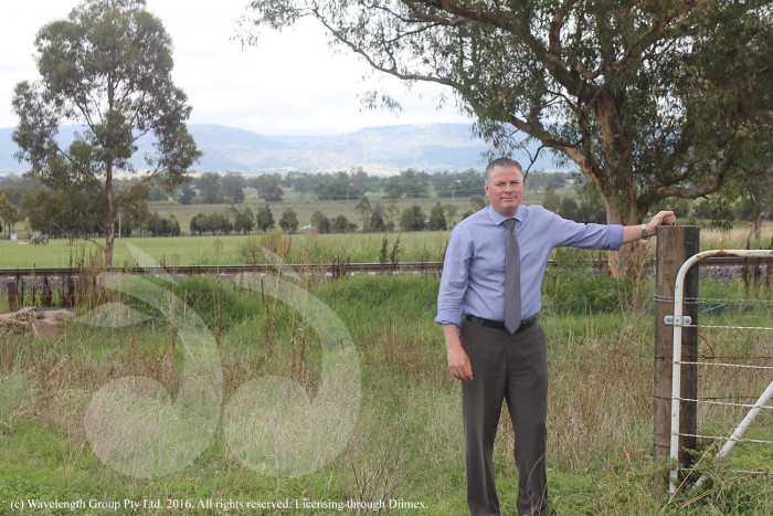Waid Crockett, general manager of Upper Hunter Shire Council, shows where a road from the New England Highway could join with Muffett Street.