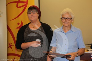 Granddaughter of Hunter McLoughlin, Summer McLoughlin presenting the Hunter McLoughlin Memorial Citizen ofthe Year to Margaret Cooper at the Scone Australia Day Celebrations.