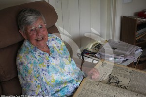 Betty Pinkerton spending some time looking through old copies of the local paper