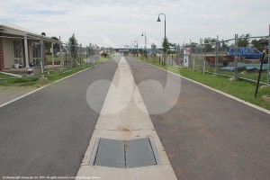 The road through the retirement village leading to the new aged care facility, with 1.5 metre square culverts beneath it