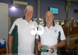 Paul Gorman, president of the club congratulates Gary Morley for his hole-in-one on the 17th hole at Muswellbrook