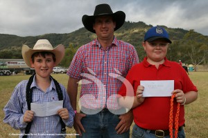 Judge Andrew Swain with first and second placed in the goat races - Ryan Taylor (right) Murrurundi and Ryan Palmer, Quirindi.