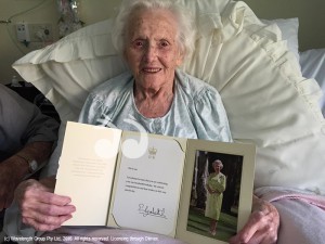 Mrs Cone holding a letter from Her Majesty Queen Elizabeth II