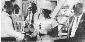 Scone owner, Harry Hayes (left) receives his winner’s trophy from Mrs. Quinn at an Aberdeen meeting in the 1960s, watched by former trainer Eric Cribb and then Aberdeen Race Club President Mr. Arthur Taylor (right).