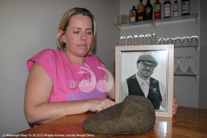 Jennifer Grenenger with a photo of her husband Craig and his well know 'grandpa' style cap