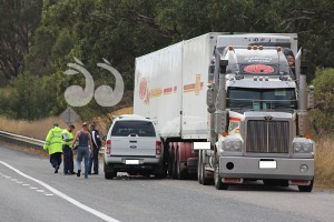 A ute also collided with the truck south of the white sedan.