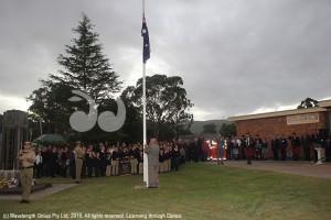 The last post being played as Val Quinell, president of the Scone RSL sub-branch raises the flag at the Scone ANZAC Day awn service.