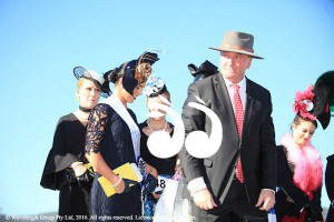 Barnaby Joyce presenting the sash for the winner of best dressed local to Chelsea Stuart.