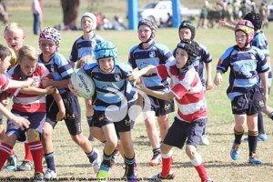 Scone Under-10’s player Will Nugent busting through the Walcha defence.