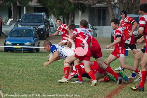Josh Watson being tackled.