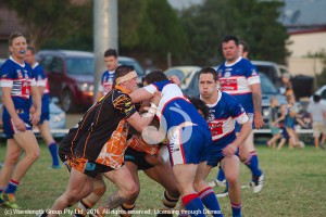 First Grade: James Barker taking on the defence.