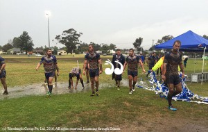 Waking off the field after a muddy match.