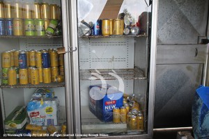 The smashed glass door of the fridge and the empty shelf where the run used to be.