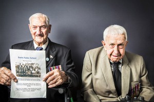 World War II veterans Athol Rose andJack Flaherty. Athol Rose is holding a photograph of him and Jack as school boys.