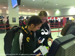 Amy Parkinson and Bethany Lloyd checking in for their flight to the world futsal championships.