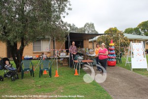 Stanley Nelson, Kim Brown and Jacinda Tatawaqa helping run the food pantry while little Willam Birch watches on.