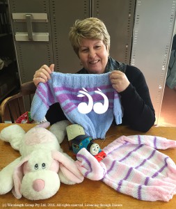 Lee Watts from the Scone Neighbourhood Resource Centre with some of the donated woollen goods.