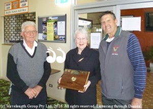 Veteran golfer Jeff McKeon is presented with the Bernie Behringer Memorial trophy, by Mrs Pam Behringer and captain Max Holz at Aberdeen Golf Club on Tuesday, July 26 following the Veteran Golfers’ annual Par-3 event.