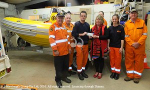 Elizabeth Birch from the Aberdeen Highland Games handing over a donaation to the Aberdeen SES unit. L- R Mick Batten, Ray Butchard, Tim McElroy,Elizabeth Birch Aberdeen Highland Games Inc. Monique Mohr, Bob Kegan and Andrew Clarke in the boat.