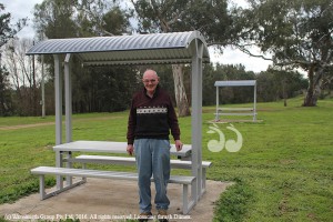 Paul Hobbs, secretary of the Aberdeen Men's Shed with two of the picnic tables at the Aberdeen Rodeo ground.