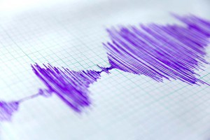 Seismological device for measuring earthquakes. Seismological activity live on the sheet of measuring paper.