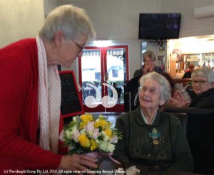 President, Carolyn Carter presenting Del Smith with flowers and the Garden Clubs Australia 'Ann Williams Clark' Medallion .