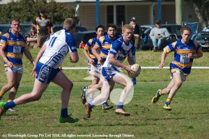 Lachlan Walmsley looking to offload in the 18's game.