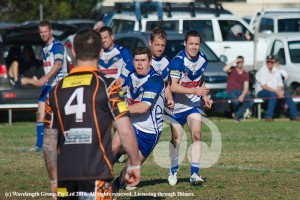 Tim Watson without a hair out of place attacks the Tigers defence