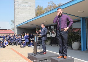 Sandy Warburton auctioning off teacher Aaron Mahony as a slave to the students St Joseph's High School.