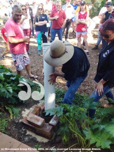 Peter Barnett with Kathy Barnett burying the time capsule at the Moonan Pub.