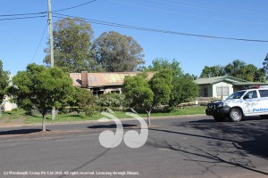 Police secure the Scott Street house while waiting for forensic services to arrive.