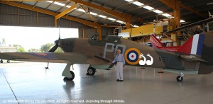 Lysle Roberts looking over the recently restored Hawker Hurricane in the Scone hanger.