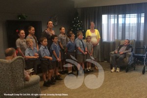 The residents of Middlebrook house enjoying some christmas carols from the Beltrees Primary School.