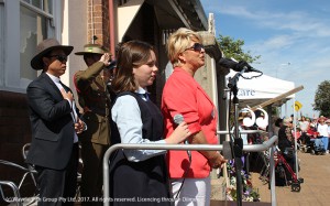 Mia and Tash Holden perform the national anthem.