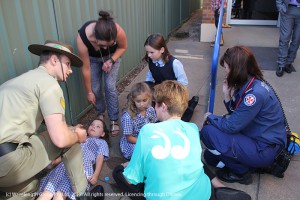 Corporal Ben Walters and paramedic Melinda Walters tending to people who had fainted at the ANZAC Day ceremony.