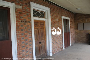 The brickwork of the original buildng is still intact, with the 1960's extensions visible at the end of the verandah.