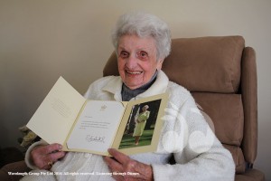 Alma Lennone holding her birthday well wishes from the Queen. 