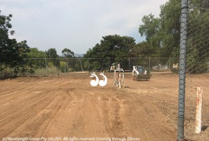 The backhoe beginning work at the Gundy tennis court.