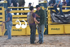 Adriano Moraes mentoring a young bull rider on the weekend.
