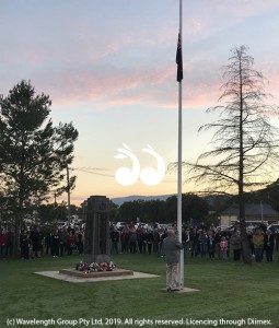 Val Quinell, president of the Scone RSL Sub-branch raising the flag during the Scone dawn service.