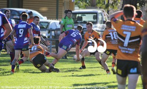 Ryan Holman with the ball playing against Denman.